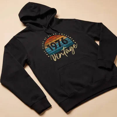 Retro distressed shirt celebrating 50 years of being awesome in orange and teal — printed on a unisex hoodie
