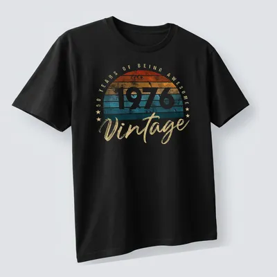 Retro distressed shirt celebrating 50 years of being awesome in orange and teal — printed on a unisex t-shirt (angled view)