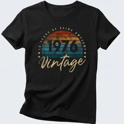 Retro distressed shirt celebrating 50 years of being awesome in orange and teal — printed on a women's shirt