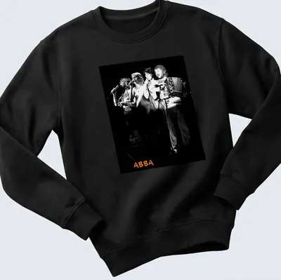 Black and white photo of ABBA performing with orange accents — printed on a unisex sweatshirt