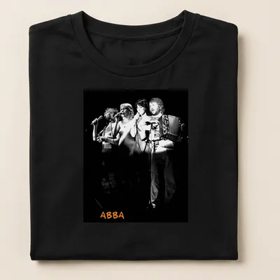 Black and white photo of ABBA performing with orange accents — printed on a women's shirt