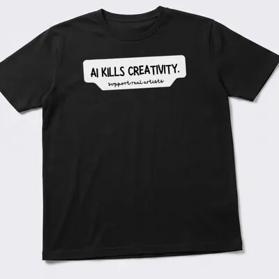 Bold handwritten text on a t-shirt stating AI KILLS CREATIVITY and support real artists