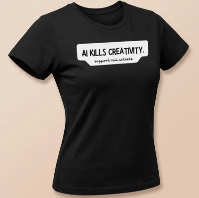 Bold handwritten text on a t-shirt stating AI KILLS CREATIVITY and support real artists — printed on a women's shirt