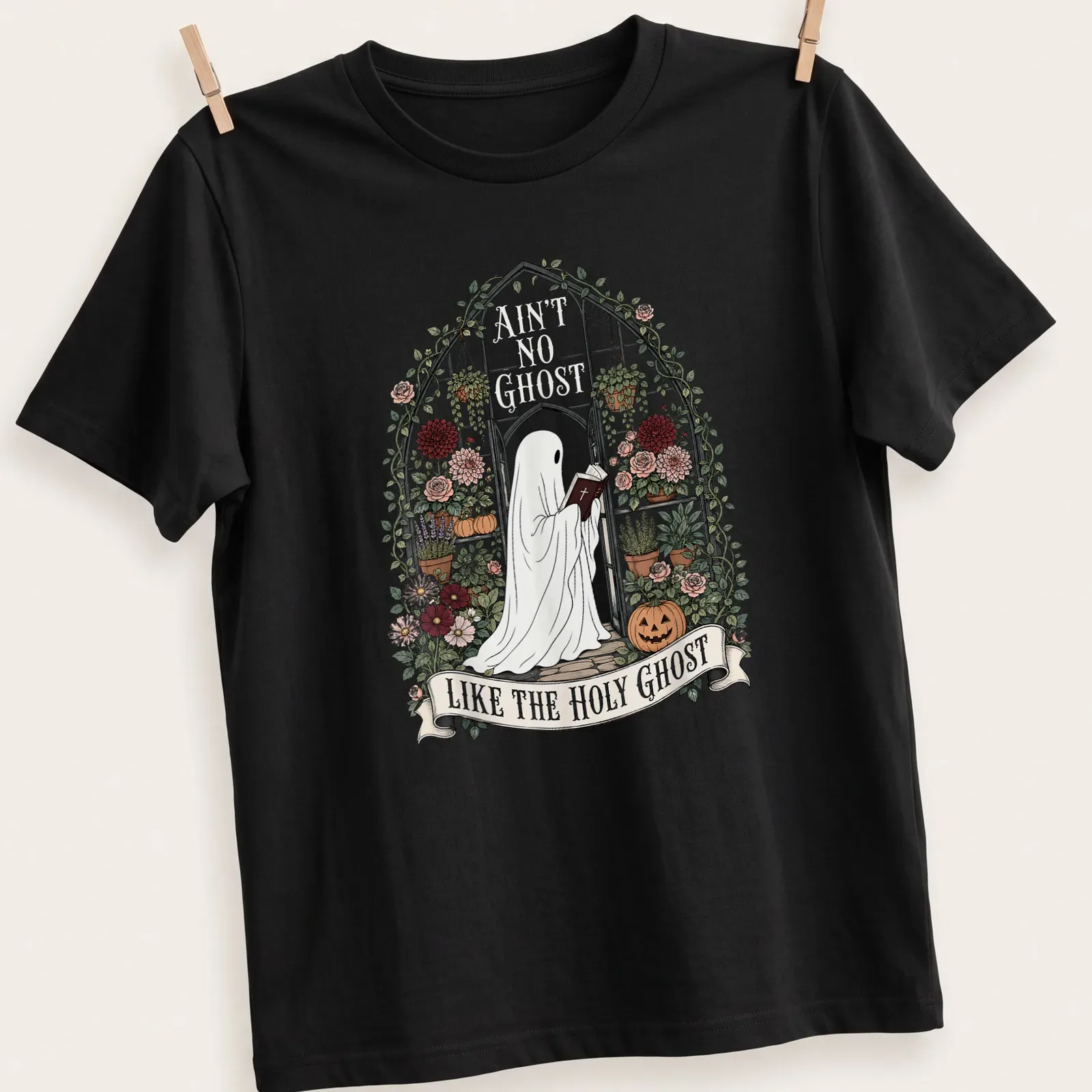 Ghost reading a Bible with floral accents and humorous text — printed on a unisex t-shirt
