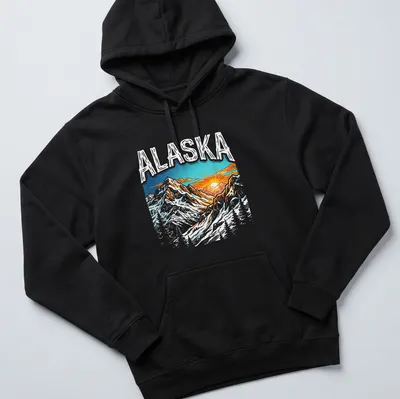 Vibrant illustration of Alaska mountain terrain with sunset and colorful sky — printed on a unisex hoodie