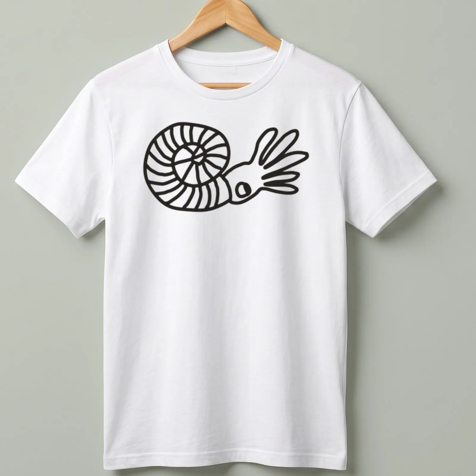 Minimalist line art of an ammonite with the word Ammonite printed above it — printed on a unisex t-shirt