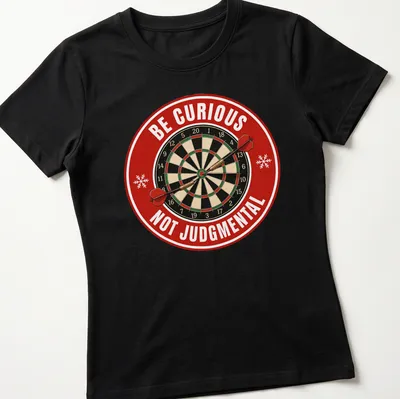 Vintage dartboard graphic with text 'Be Curious Not Judgmental' in festive colors. — printed on a women's shirt
