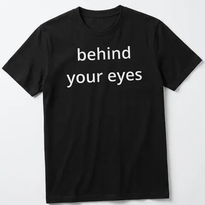Typographic design featuring the phrase 'behind your eyes' on a minimalist T-shirt.