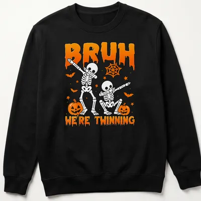 Playful cartoon skeletons with the text Bruh We're Twinning in orange and black — printed on a unisex sweatshirt