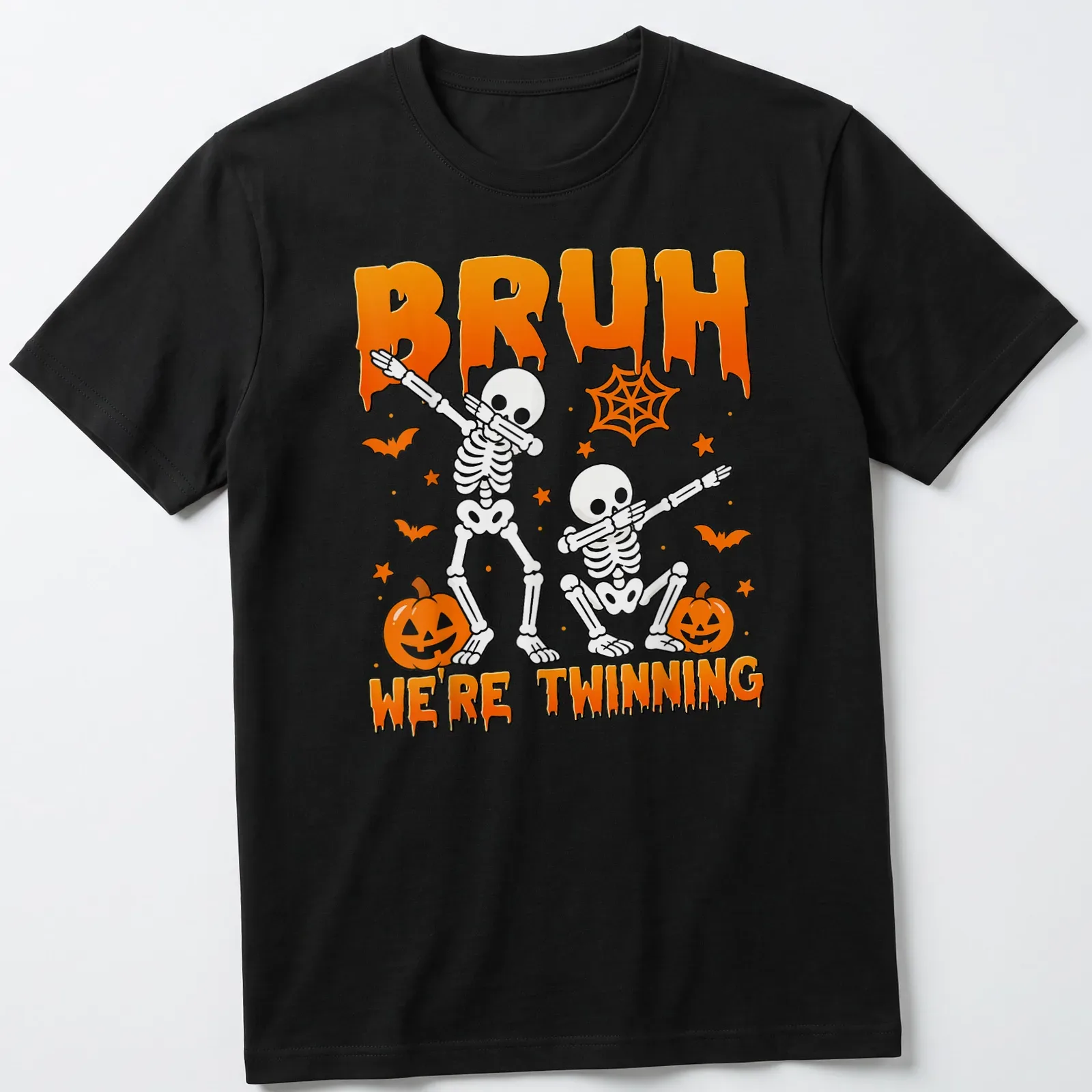 Playful cartoon skeletons with the text Bruh We're Twinning in orange and black — printed on a unisex t-shirt