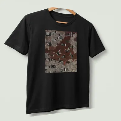 Aboriginal art pattern t-shirt featuring abstract dot painting in various colors — printed on a unisex t-shirt (angled view)