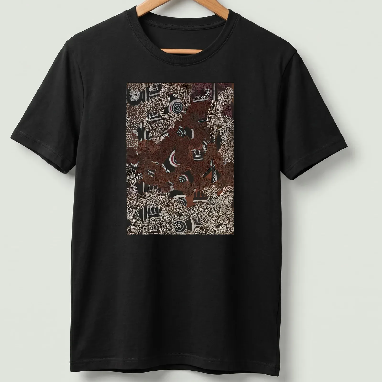 Aboriginal art pattern t-shirt featuring abstract dot painting in various colors — printed on a unisex t-shirt