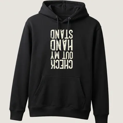 Distressed typography t-shirt featuring the phrase Check Out My Hand Stand in white, cream, and gold. — printed on a unisex hoodie