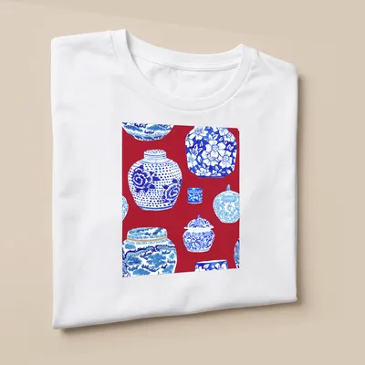 Watercolor print of ginger jars in scarlet red, blue, and white on a — printed on a unisex t-shirt (angled view)