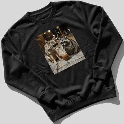 Coyote and raccoon in sunglasses with iced coffee, in urban wildlife photography style. — printed on a unisex sweatshirt