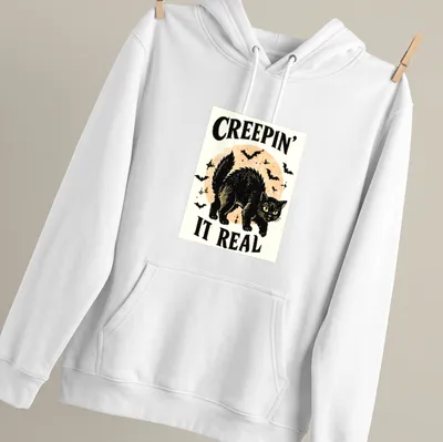 Vintage illustration of a playful black cat with Halloween text — printed on a unisex hoodie