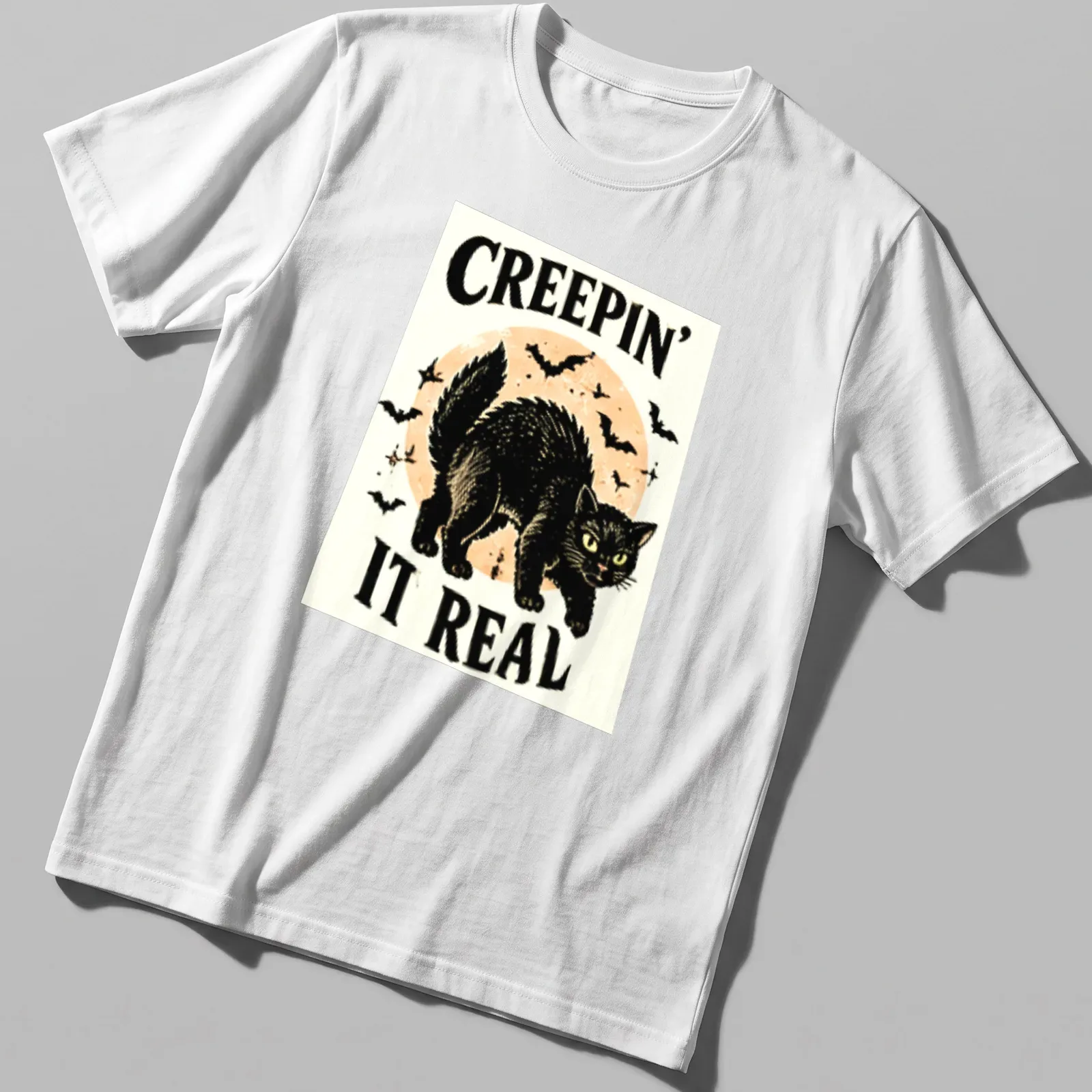 Vintage illustration of a playful black cat with Halloween text — printed on a unisex t-shirt