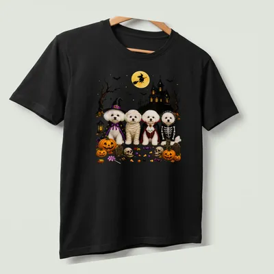 Illustration of Bichon Frise dogs in Halloween costumes with festive colors — printed on a unisex t-shirt (angled view)