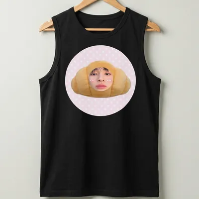 Kawaii cute croissant t-shirt featuring a smiling croissant character in pink and beige — printed on a tank top