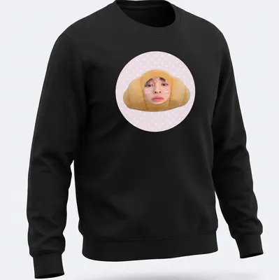 Kawaii cute croissant t-shirt featuring a smiling croissant character in pink and beige — printed on a unisex sweatshirt