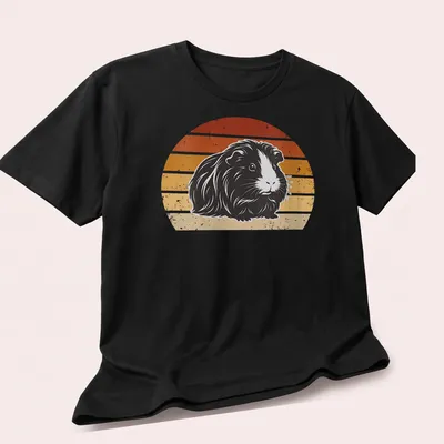Retro distressed print of a long-haired guinea pig surrounded by rainbow colors — printed on a unisex t-shirt (angled view)