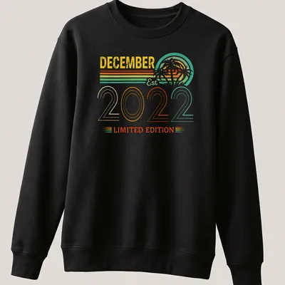 Retro design of palm trees with December Est 2022 Limited Edition text in bright colors. — printed on a unisex sweatshirt