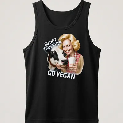 Cartoon cow graphic with bold text urging veganism in playful colors — printed on a tank top
