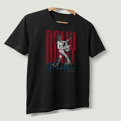 Distressed portrait of Dolly Parton with text in red, white, and blue — printed on a unisex t-shirt (angled view)