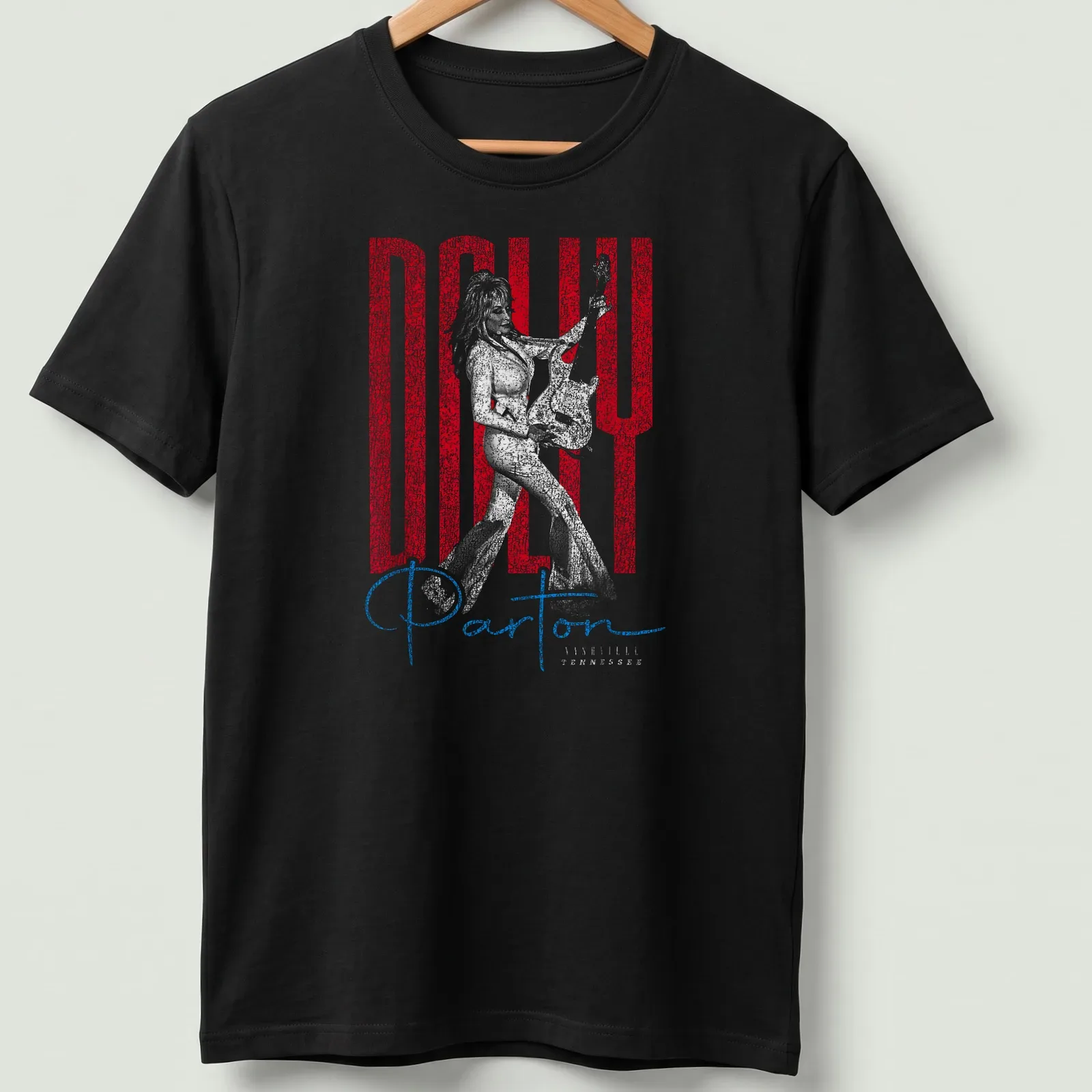 Distressed portrait of Dolly Parton with text in red, white, and blue — printed on a unisex t-shirt