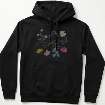 Watercolor print of 'Dolly' surrounded by a butterfly and colorful flowers — printed on a unisex hoodie