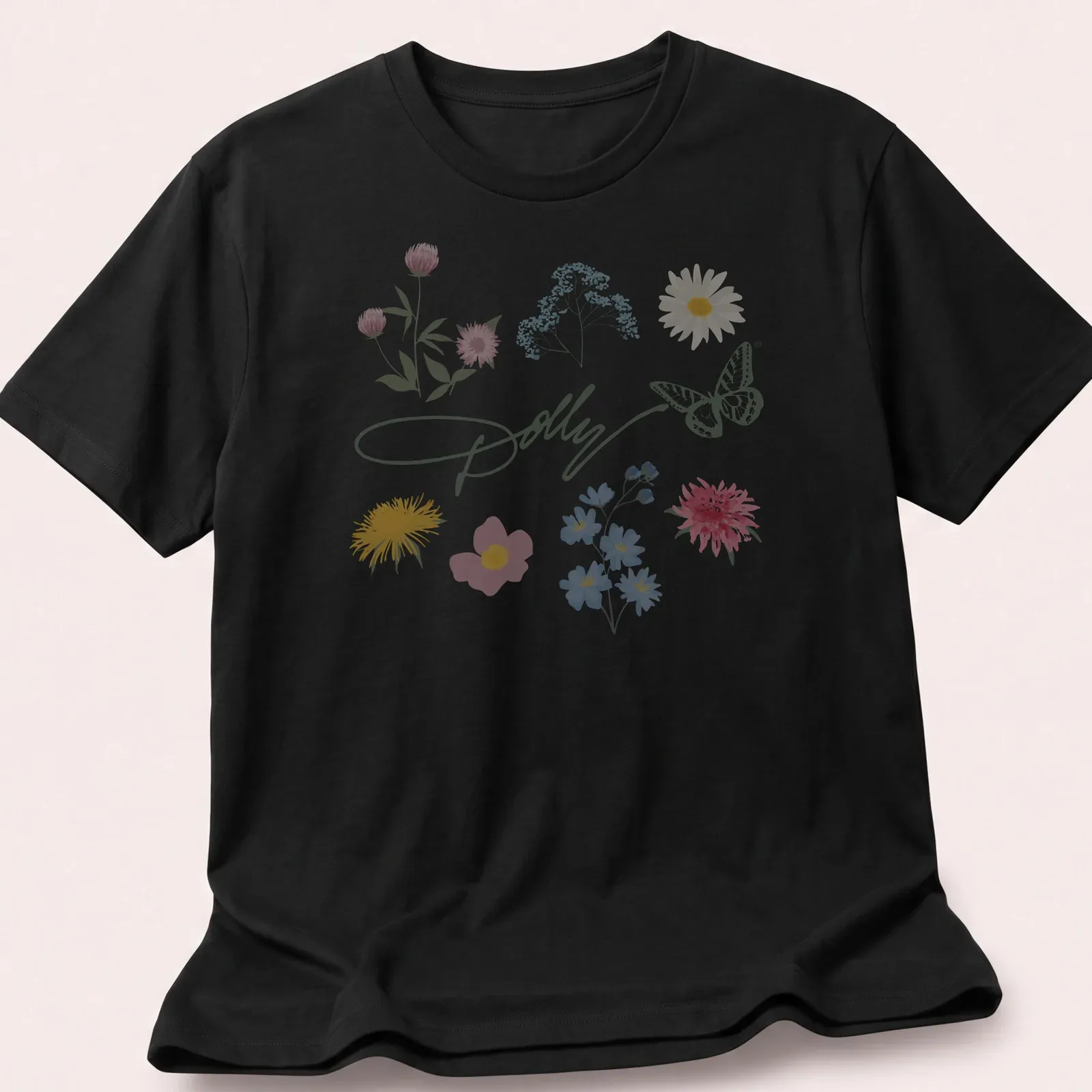 Watercolor print of 'Dolly' surrounded by a butterfly and colorful flowers — printed on a unisex t-shirt