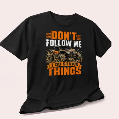 Grunge style t-shirt featuring off-road vehicle and humorous text about driving. — printed on a unisex t-shirt (angled view)