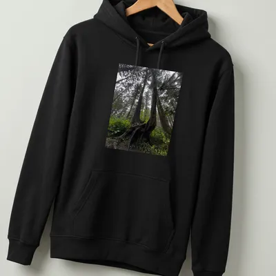 Illustration of intricate tree roots in a natural landscape with earthy colors — printed on a unisex hoodie