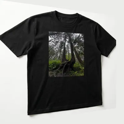 Illustration of intricate tree roots in a natural landscape with earthy colors — printed on a unisex t-shirt (angled view)