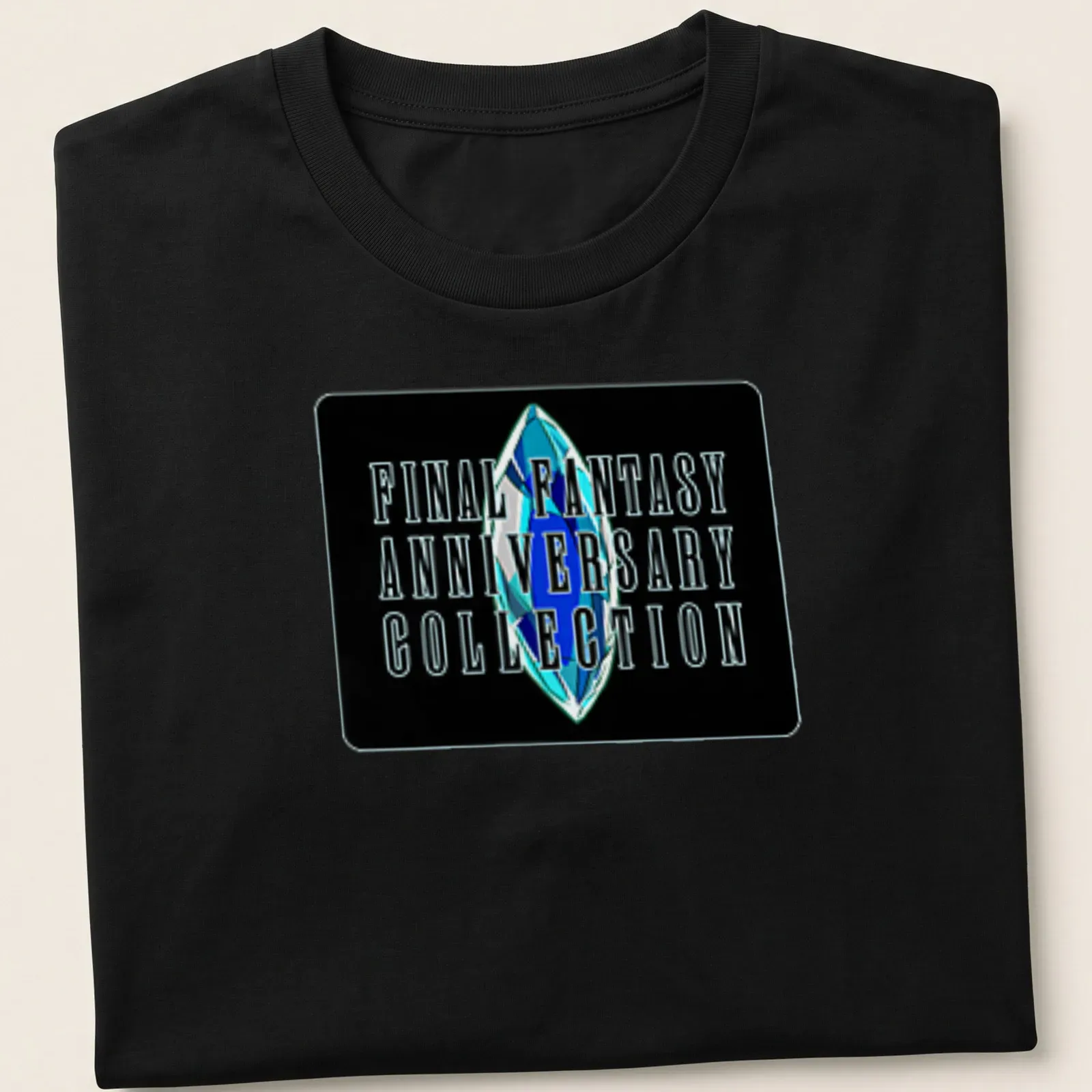 Bold typography featuring Final Fantasy Anniversary Collection with a crystal motif — printed on a unisex t-shirt
