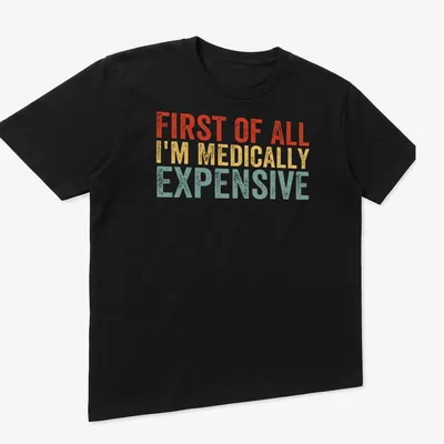 Bold retro humor shirt with text 'First Of All I’m Medically Expensive' in bright colors — printed on a unisex t-shirt (angled view)