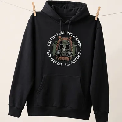 Vintage distressed T-shirt featuring a gas mask with text about paranoia and preparedness — printed on a unisex hoodie