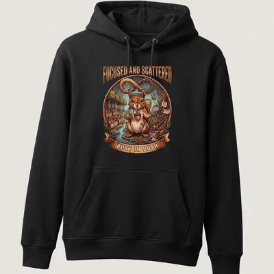 Detailed illustration of a squirrel with the text 'Focused and Scattered Busy In Both' in colorful font — printed on a unisex hoodie