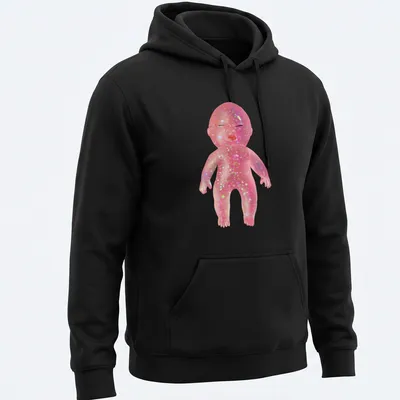 Whimsical illustration of a glittery baby doll with colorful details — printed on a unisex hoodie