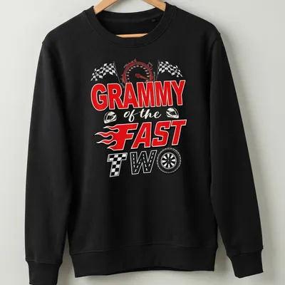 Bold graphic t-shirt with text 'GRAMMY of the FAST TWO' and a racing car illustration in red, black, white, and yellow — printed on a unisex sweatshirt