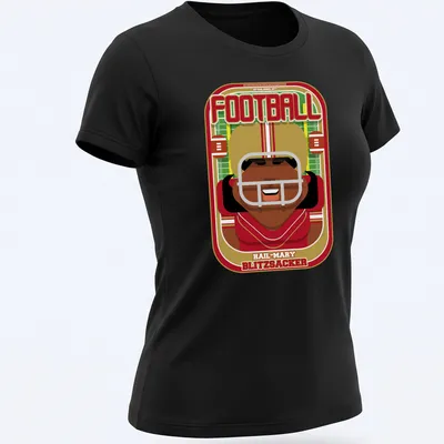 Retro cartoon football player graphic with bold text in red and gold — printed on a women's shirt