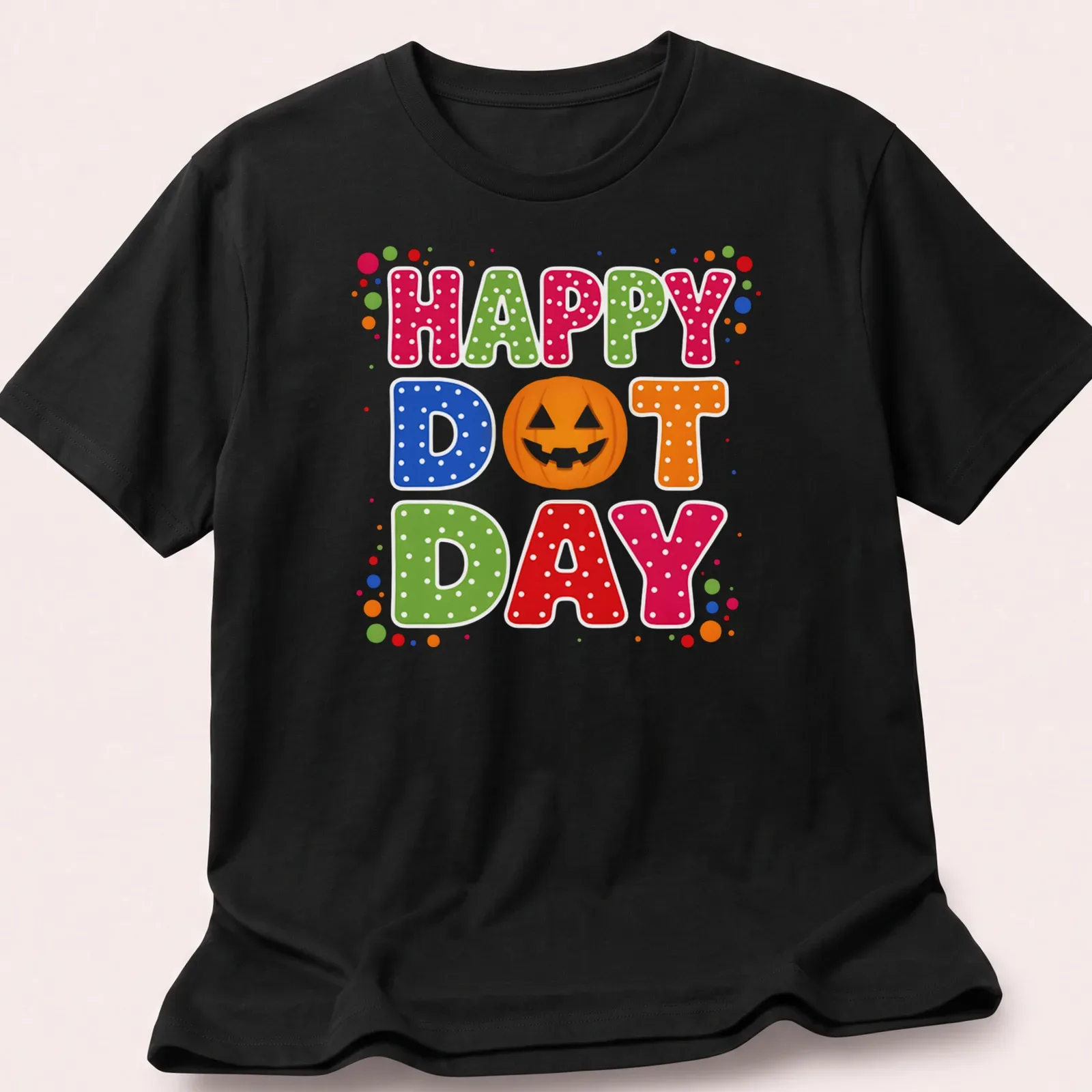Colorful pumpkin design with Happy Dot Day text in retro polka dot style — printed on a unisex t-shirt