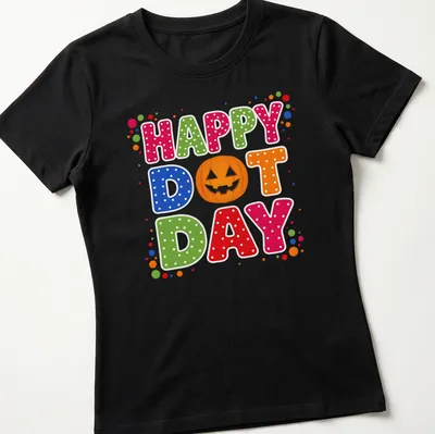 Colorful pumpkin design with Happy Dot Day text in retro polka dot style — printed on a women's shirt