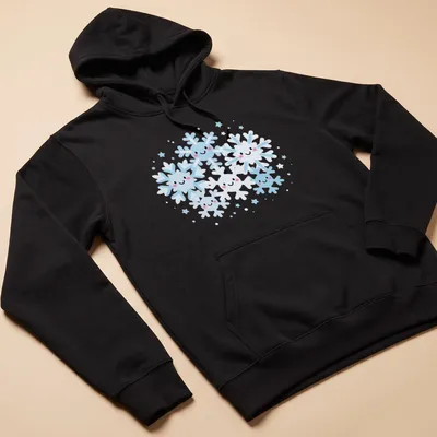 Kawaii design featuring smiling snowflakes in light blue, white, and pink. — printed on a unisex hoodie