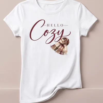 T-shirt with 'Hello Cozy' script above a plaid scarf in warm autumn colors — printed on a women's shirt
