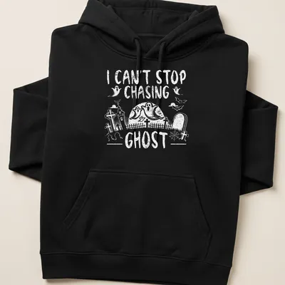 Halloween-themed T-shirt with a playful ghost design and text about chasing ghosts — printed on a unisex hoodie