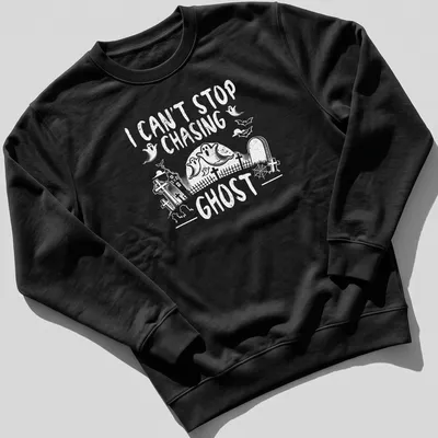 Halloween-themed T-shirt with a playful ghost design and text about chasing ghosts — printed on a unisex sweatshirt