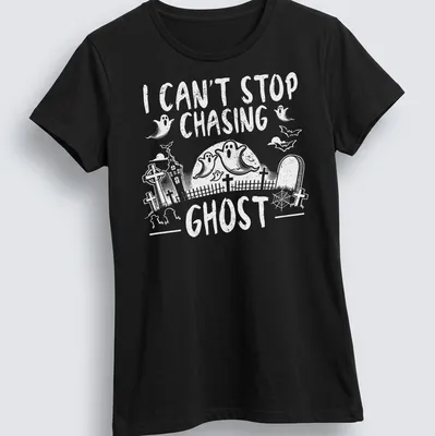 Halloween-themed T-shirt with a playful ghost design and text about chasing ghosts — printed on a women's shirt