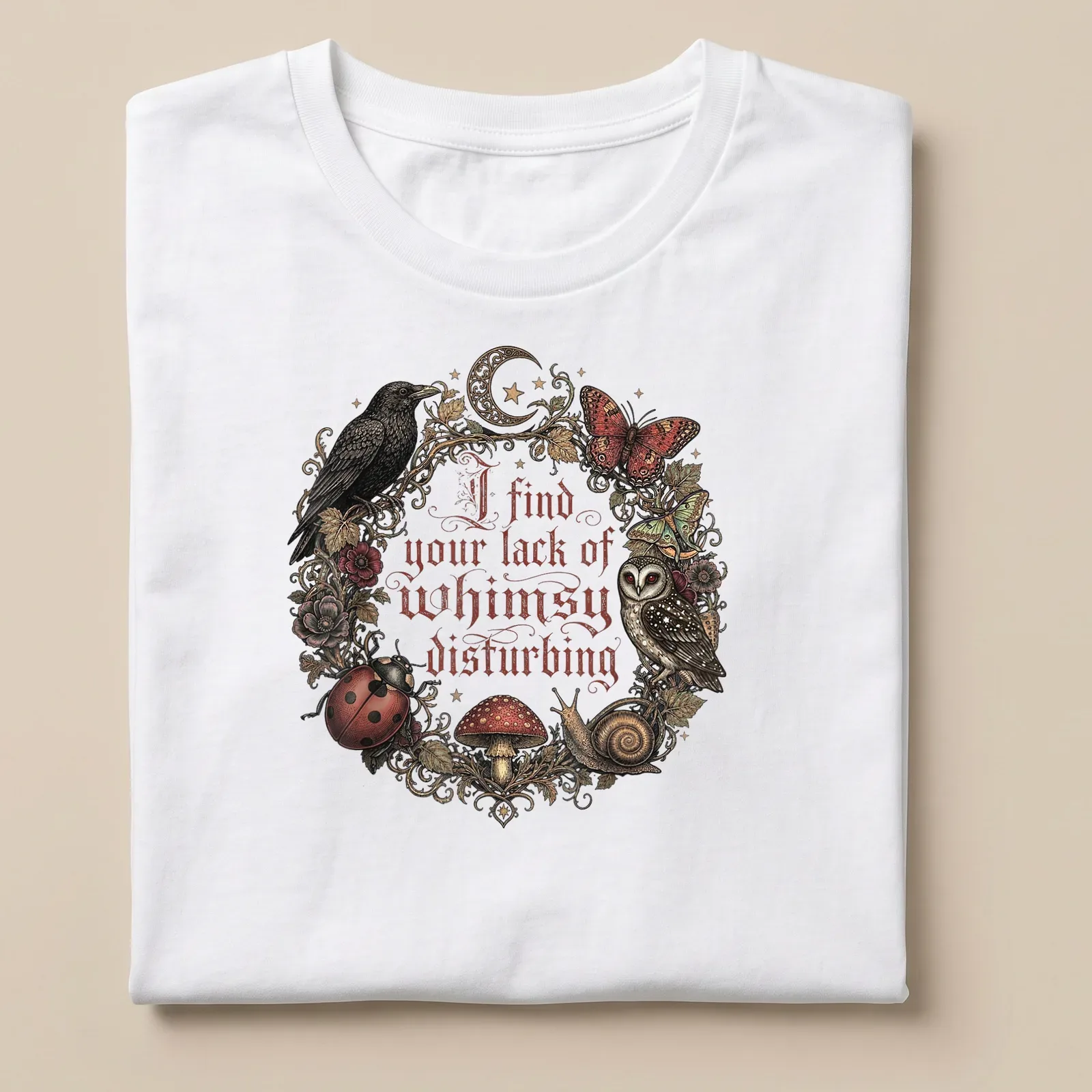 Vintage ornate print of an owl, mushrooms, and other forest creatures with whimsical text — printed on a unisex t-shirt
