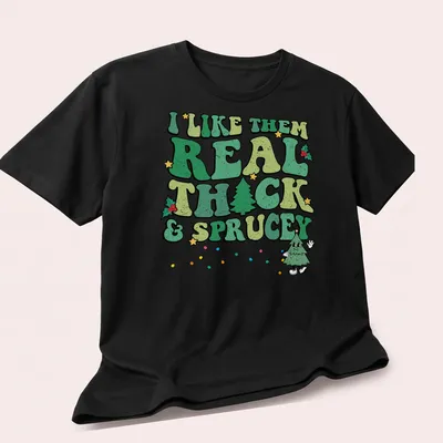 Funny Christmas tree t-shirt with retro text about liking thick and sprucey trees — printed on a unisex t-shirt (angled view)